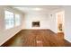 Bright Gathering room with hardwood floors and fireplace at 110 Randomwood Way, Alpharetta, GA 30022