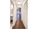 Long hallway with built-in storage and hardwood floors at 110 Randomwood Way, Alpharetta, GA 30022