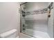 Bathroom with shower/tub combo and updated tile at 2418 Claude Brewer Road Rd, Loganville, GA 30052