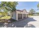 Three-car detached garage with white exterior at 2418 Claude Brewer Road Rd, Loganville, GA 30052