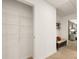 Walk-in closet featuring wire shelving, situated in a hallway near a bedroom with bench seating at 301 Sound Cir, Stockbridge, GA 30281