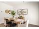 Dining room with hardwood floors, modern decor, and comfortable seating for six at 301 Sound Cir, Stockbridge, GA 30281