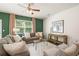 Living room with gray sofas and ceiling fan at 301 Sound Cir, Stockbridge, GA 30281