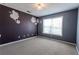 Bedroom with purple and gray walls and plush carpeting at 335 Wilma Sw Ct, Atlanta, GA 30331