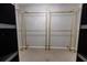 Closet with gold clothing racks and shelving at 335 Wilma Sw Ct, Atlanta, GA 30331