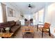 Open living area with leather sofas, coffee table, and a view into another seating area at 335 Wilma Sw Ct, Atlanta, GA 30331