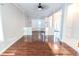 Open living room with hardwood floors, a fireplace, and access to other rooms at 335 Wilma Sw Ct, Atlanta, GA 30331