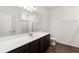 Clean bathroom with a modern vanity, bright lighting, and a large mirror at 3745 Newbury Place Dr, Loganville, GA 30052