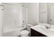 This bathroom has a bathtub and shower combo, toilet, and vanity with a sink at 3745 Newbury Place Dr, Loganville, GA 30052