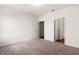 Bright bedroom with neutral carpet and doorways to closet and bathroom at 3745 Newbury Place Dr, Loganville, GA 30052