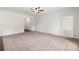 Spacious living room with neutral carpet and plenty of natural light at 3745 Newbury Place Dr, Loganville, GA 30052