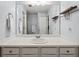 Bathroom featuring a white vanity sink and countertop and a large mirror at 4405 Maple Valley Dr, Cumming, GA 30040