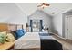 Bright bedroom featuring a vaulted ceiling, carpet, and plenty of natural light from the window at 4405 Maple Valley Dr, Cumming, GA 30040