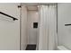 Close up of shower with subway tiles and black pebble floor at 1230 Worthington Hills Dr, Roswell, GA 30076