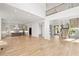 Open-concept living area featuring hardwood floors, soaring ceilings, and abundant natural light at 3661 Clubwood Trl, Marietta, GA 30068