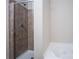 Bathroom featuring a shower with tiled walls and a soaking tub for ultimate relaxation at 4805 West Village Way # 3207, Smyrna, GA 30080