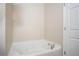 Bright bathroom showcasing a clean, white bathtub with jacuzzi jets and chrome fixtures at 4805 West Village Way # 3207, Smyrna, GA 30080