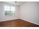 Empty bedroom featuring wood floors and a sun-filled window at 4805 West Village Way # 3207, Smyrna, GA 30080