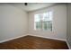 Empty bedroom with vinyl floors, neutral walls, and a window at 4805 West Village Way # 3207, Smyrna, GA 30080