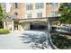Apartment building with covered parking and nicely landscaped grounds at 4805 West Village Way # 3207, Smyrna, GA 30080