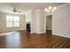 Bright living room with a fireplace and gleaming wood floors at 4805 West Village Way # 3207, Smyrna, GA 30080