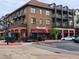 A street view showcasing a restaurant with outdoor seating and nearby parking at 4805 West Village Way # 3207, Smyrna, GA 30080