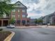 A street view of a commercial building with a pizza restaurant and outdoor dining area at 4805 West Village Way # 3207, Smyrna, GA 30080