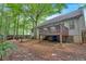 House backyard with deck and wooded area at 49 Ne Kay Rd, White, GA 30184