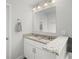 Bathroom with double sink vanity, granite countertop and large mirror at 679 Mcwilliams Se Rd, Atlanta, GA 30315