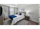 Cozy bedroom with comfortable bed, blue accents, and a window for natural light at 679 Mcwilliams Se Rd, Atlanta, GA 30315