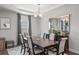 Bright dining area with decorative mirror and view to a window at 679 Mcwilliams Se Rd, Atlanta, GA 30315