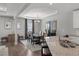 Formal dining room with elegant chandelier and large mirror, adjacent to kitchen area at 679 Mcwilliams Se Rd, Atlanta, GA 30315