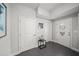 Entryway featuring a tiled floor, white doors, and decorative table at 679 Mcwilliams Se Rd, Atlanta, GA 30315