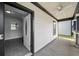 Exterior view of doorway with tiled floor and a view of the porch at 679 Mcwilliams Se Rd, Atlanta, GA 30315