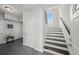 Entryway with tiled floor and stairs with wooden railing at 679 Mcwilliams Se Rd, Atlanta, GA 30315