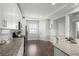 Well-lit kitchen with granite countertops, subway tile backsplash, stainless steel appliances and hardwood flooring at 679 Mcwilliams Se Rd, Atlanta, GA 30315