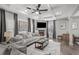 Comfortable living room with a fireplace, coffered ceilings, and large windows with custom window treatments at 679 Mcwilliams Se Rd, Atlanta, GA 30315