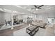 Open concept living room featuring coffered ceilings, wood floors, and open access to the kitchen at 679 Mcwilliams Se Rd, Atlanta, GA 30315