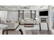 Spacious living room with a fireplace, wood floors, and an open concept design connecting to the dining area at 679 Mcwilliams Se Rd, Atlanta, GA 30315