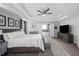 Spacious main bedroom with tray ceiling, neutral tones, ensuite bathroom, and walk in closet at 679 Mcwilliams Se Rd, Atlanta, GA 30315
