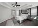 Comfortable main bedroom with a large bed, window with blinds, and art for a relaxing space at 679 Mcwilliams Se Rd, Atlanta, GA 30315
