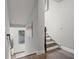 View from the top of the staircase with wood flooring, and a window at the base of the stairs at 679 Mcwilliams Se Rd, Atlanta, GA 30315