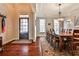 Elegant dining room boasting hardwood floors, decorative lighting, and spacious seating for ten at 7775 Georgetown Chase, Roswell, GA 30075