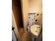 Small bathroom with shower, toilet, and pedestal sink at 1056 Welch Sw St, Atlanta, GA 30310