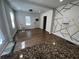 Living room with kitchen view and accent wall at 1056 Welch Sw St, Atlanta, GA 30310