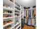 Organized walk-in closet with shelves and hanging rods for optimal storage at 305 Madison Se Ct # 305, Smyrna, GA 30080