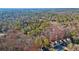 Aerial view of tree-covered lot for sale in a residential neighborhood at 550 S Rays Rd, Stone Mountain, GA 30083