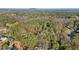Scenic aerial view of wooded acreage with a pond near a residential neighborhood at 550 S Rays Rd, Stone Mountain, GA 30083