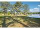 Lush green backyard offering serene views of the water at 2697 Bethel Ne Rd, Conyers, GA 30012