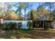 A backyard shows the landscape and an open shed at 2697 Bethel Ne Rd, Conyers, GA 30012